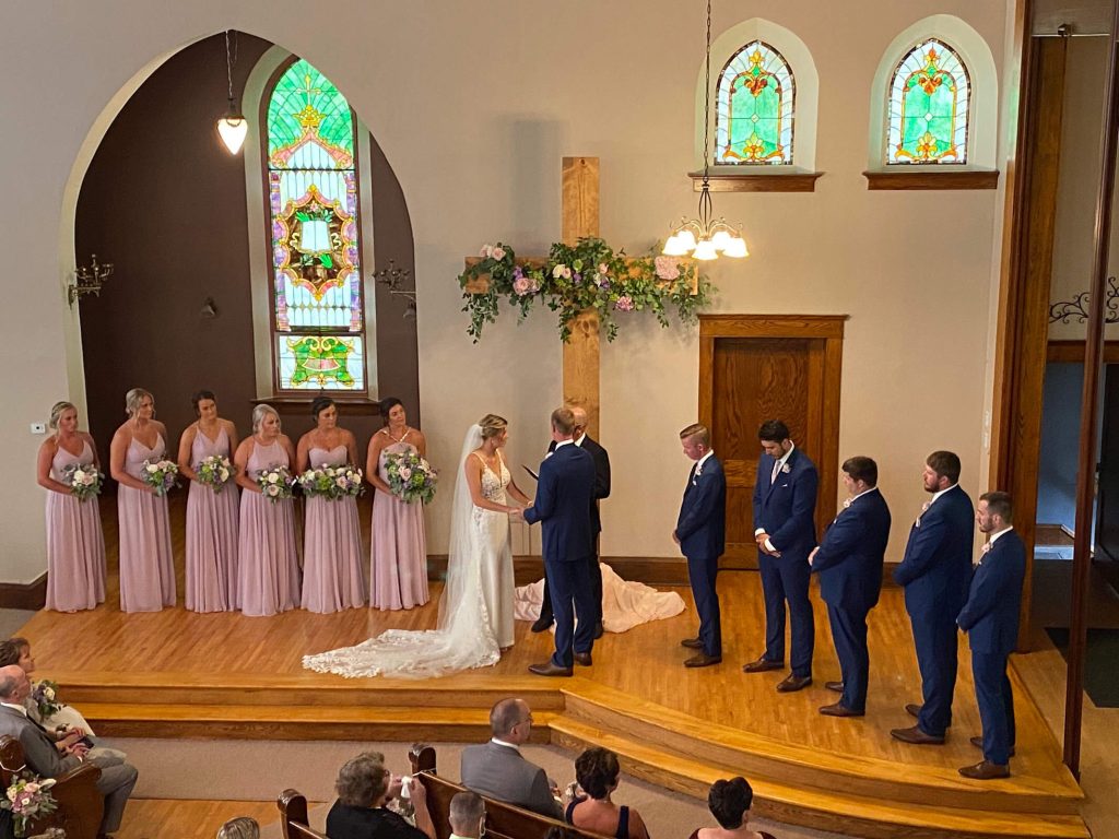 Aerial view of the wedding party at the alter at devotions wedding chapel